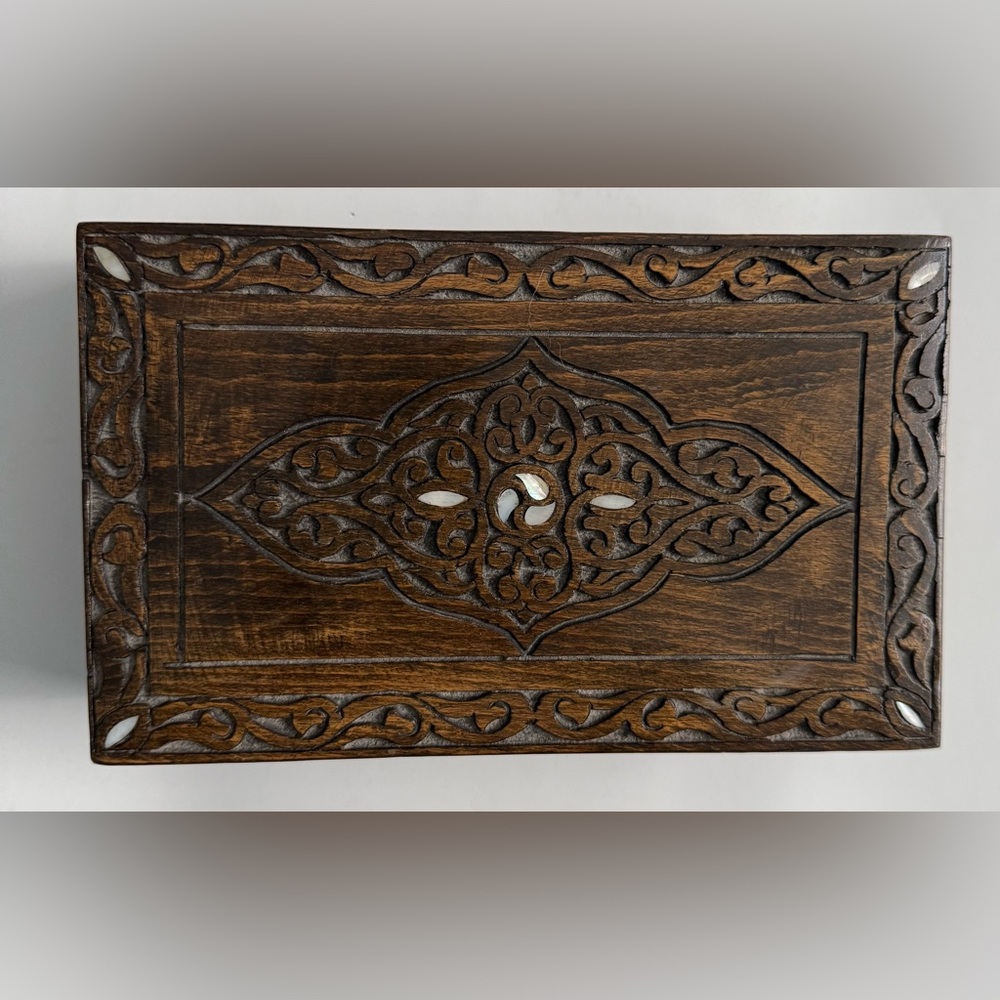 Wood, hinged storage box with ivory looking inlay.